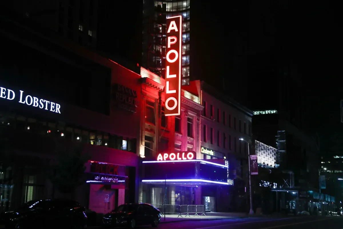The Apollo Theater marquee on 125th Street in Harlem, a stop on a NYC borough bus tour