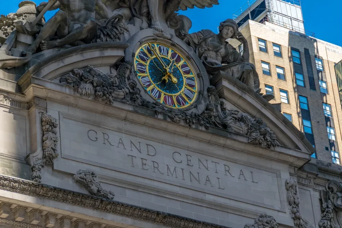 The clock and facade of Grand Central Terminal in Midtown Manhattan, a landmark to see around a half day bus tour NYC visit